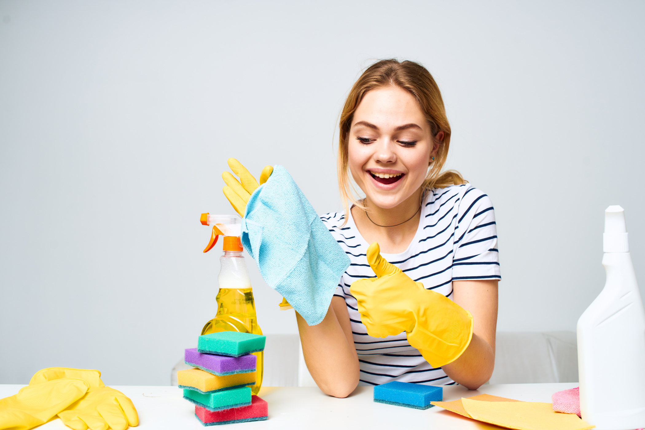 Woman Holding a Rag Cleaning Detergent Supplies Housework Interior